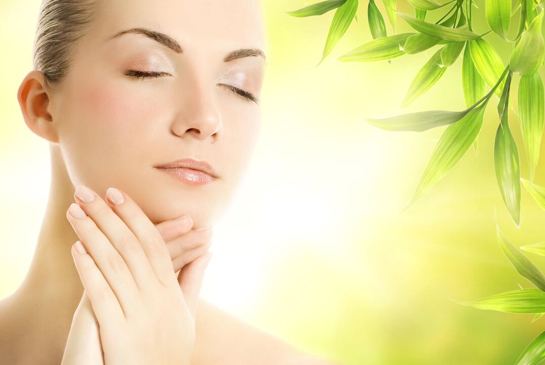 Facial skin massage with oil for rejuvenation. 